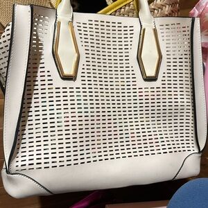 White purse and floral insert